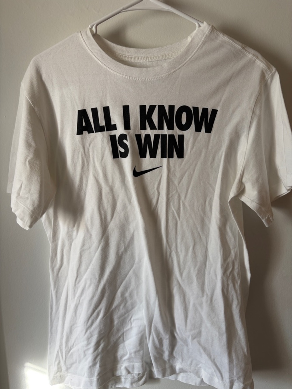 Nike White Tee with Black 'All I Know Is Win' Graphic